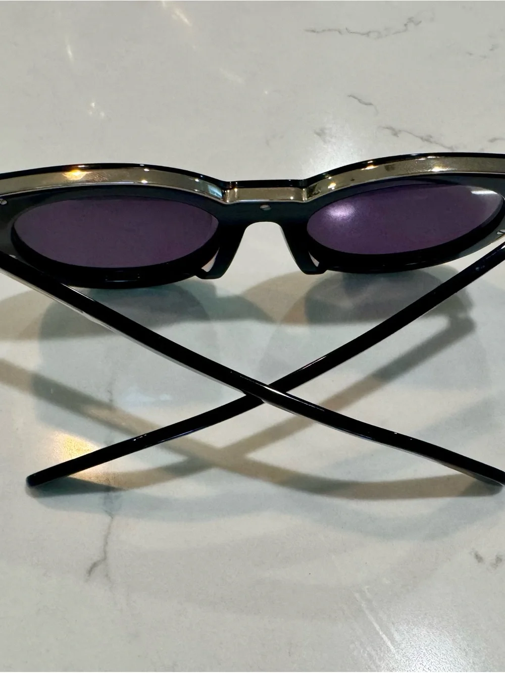 Karen Walker Black Round Sunglasses with Gold Detail and Purple Tint Lenses